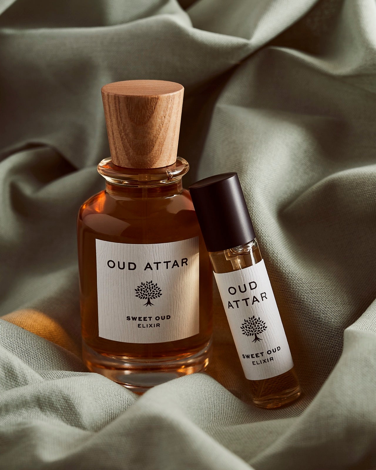 Sweet Oud bottles nestled in soft knitted fabric